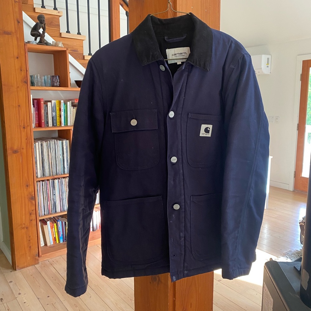 Carthart WIP women’s chore coat lined with warm quilted fabric inside.